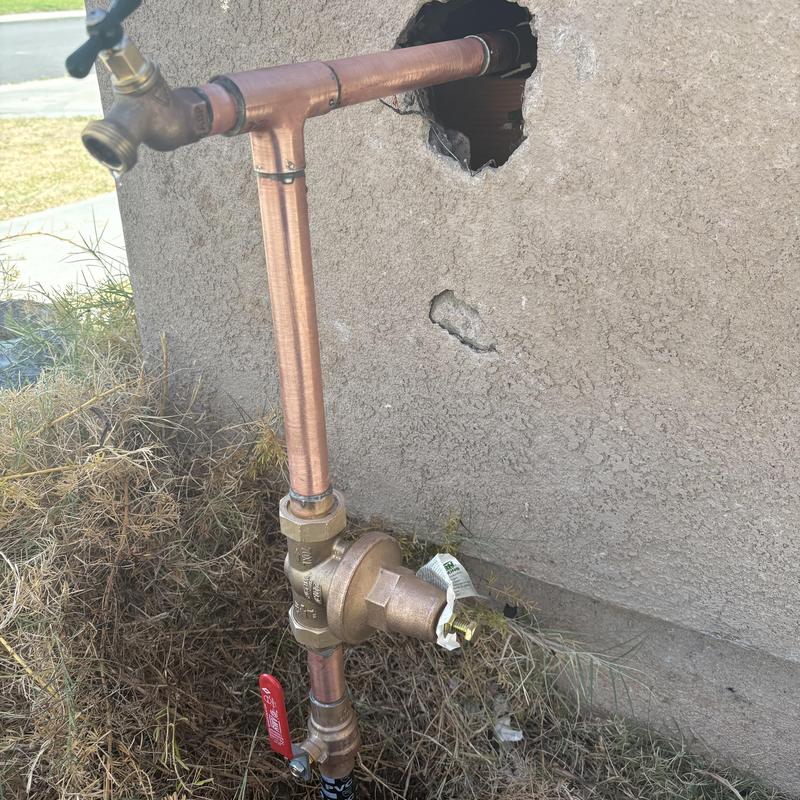 1-inch water service riser with pressure-regulating valve installed