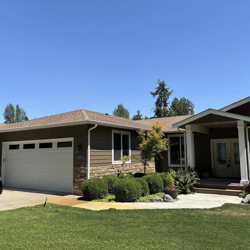 Asphalt shingle roof on residential house in Hayden, ID Asphalt shingle roof on residential house in Hayden, ID