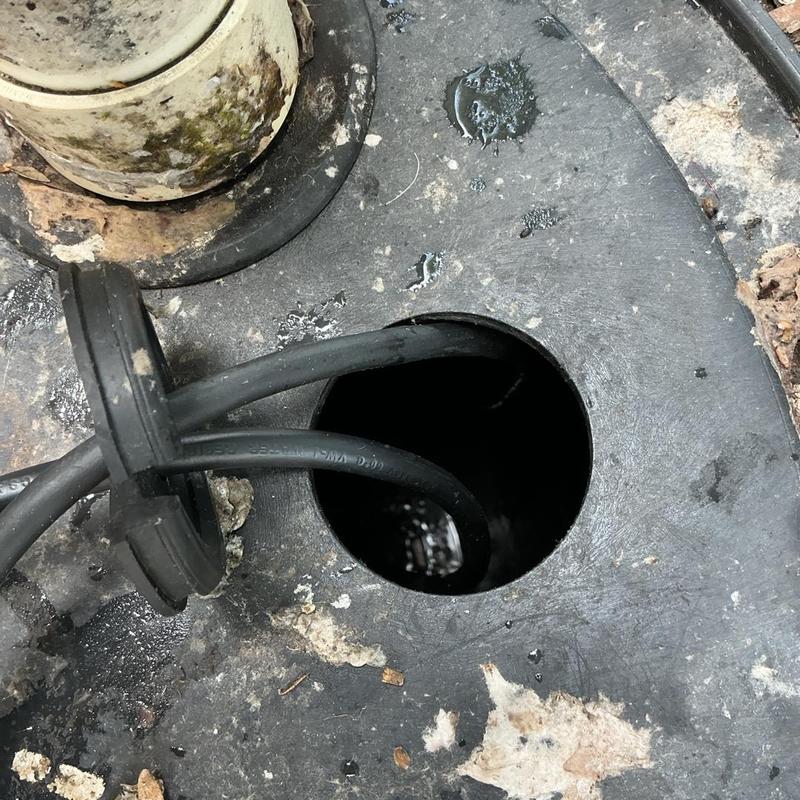 Lift station sewer pump opening with cables Lift station sewer pump opening with cables