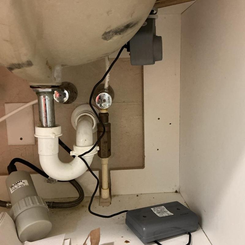 Soap dispenser sensors with wiring under bathroom sink Soap dispenser sensors with wiring under bathroom sink