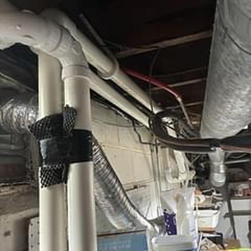 Gate valve and check valve on plumbing pipes in basement