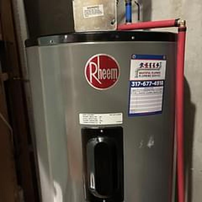 Rheem water heater with red and blue piping installation
