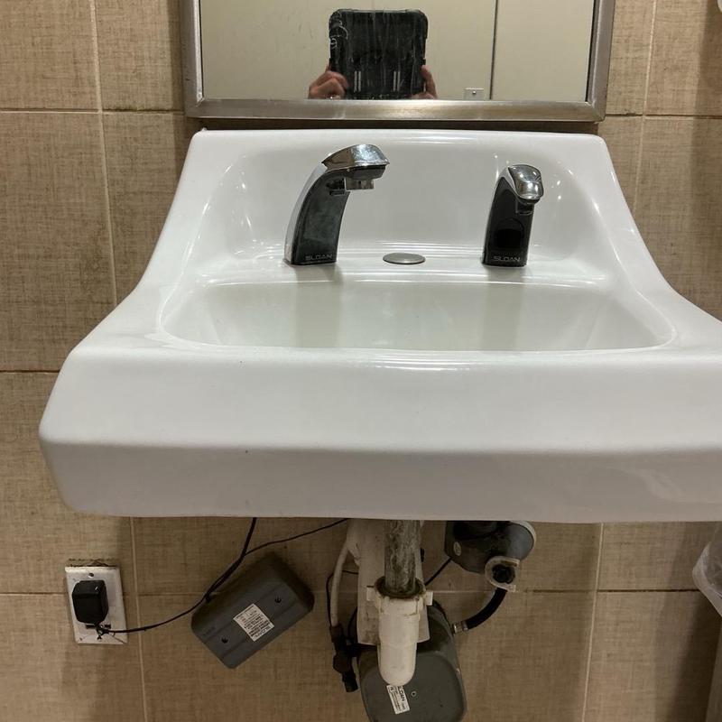 Soap dispenser and faucet installation on sink Soap dispenser and faucet installation on sink
