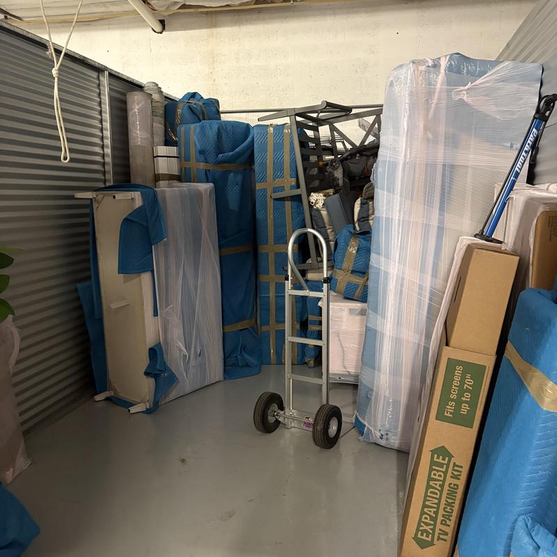 Furniture and belongings wrapped for storage move