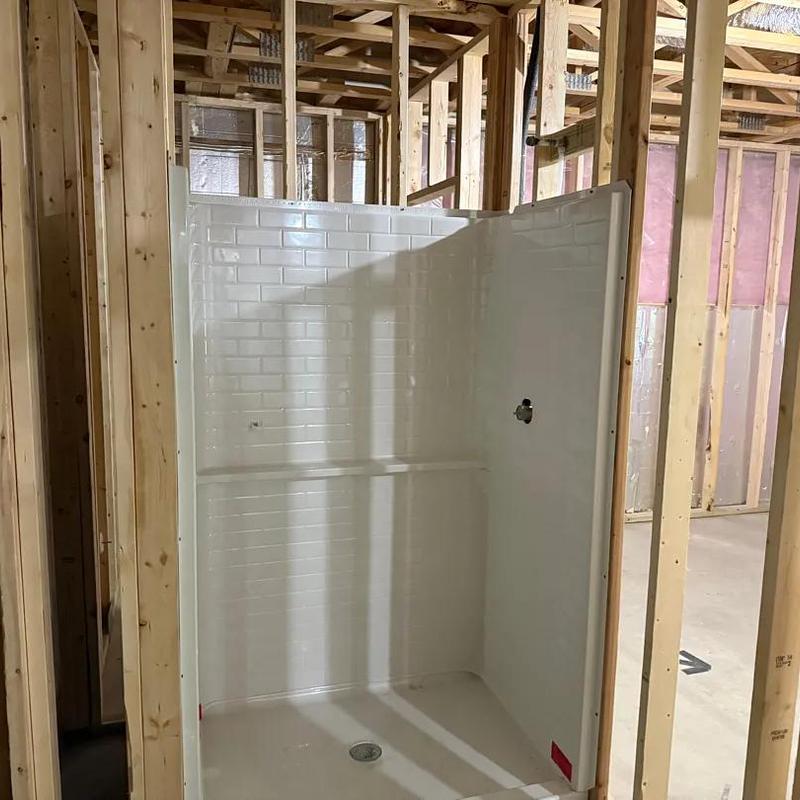 Shower stall installed in unfinished basement bathroom Shower stall installed in unfinished basement bathroom