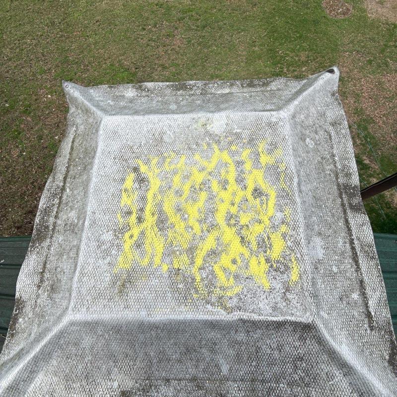 Roof vent with hail damage marked for repair