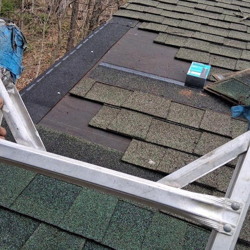 Roof shingles removed for hail damage inspection