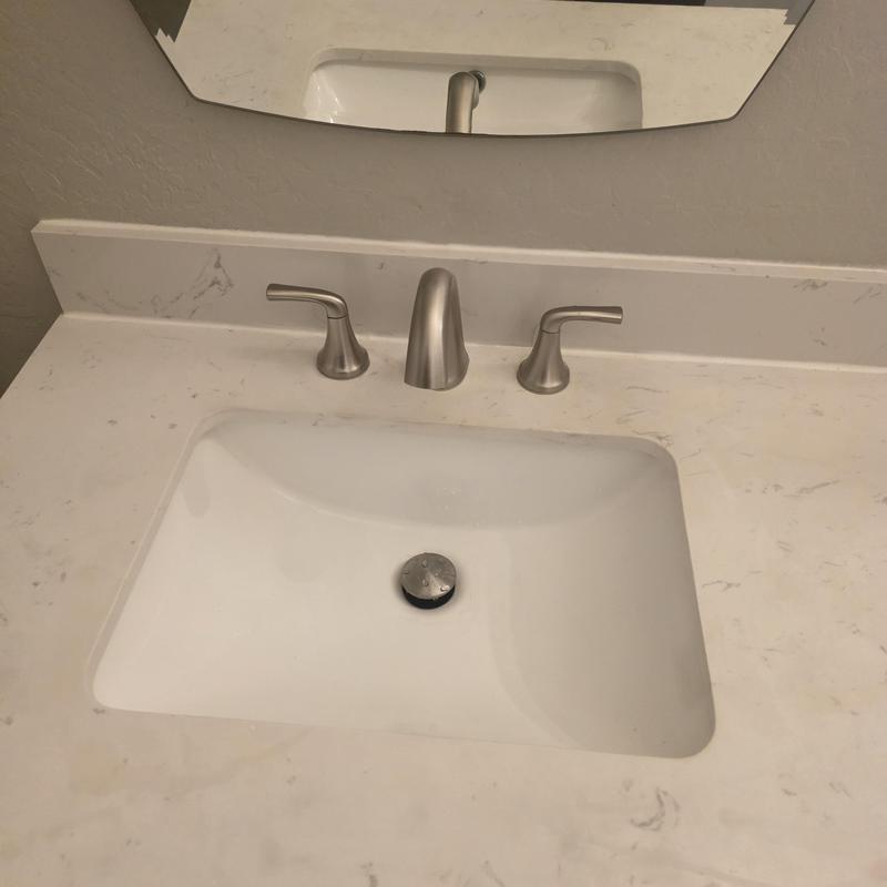 Eight-inch lavatory faucet with sink and countertop Eight-inch lavatory faucet with sink and countertop