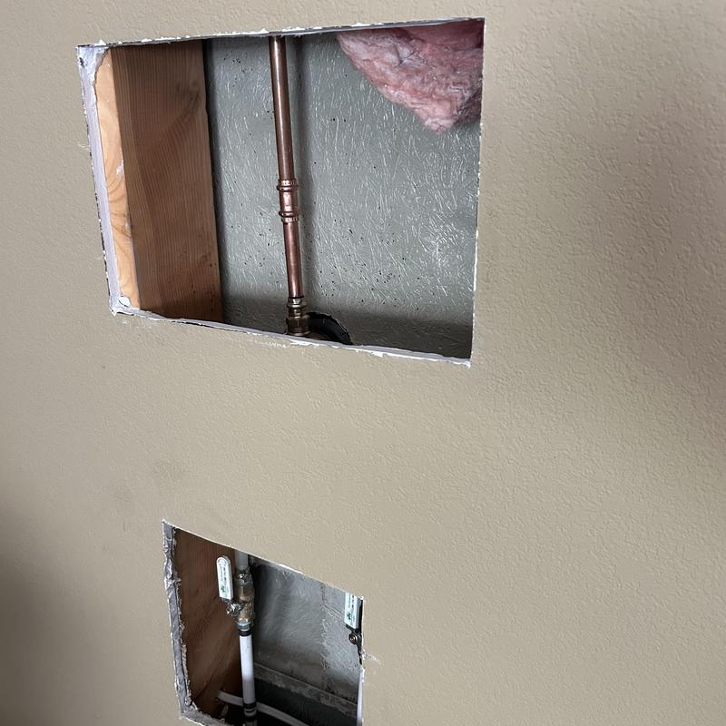 Shower valve and copper piping behind drywall access panels Shower valve and copper piping behind drywall access panels