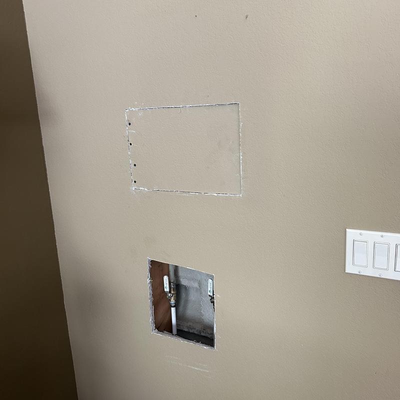 Shower valve wall access with piping exposed Shower valve wall access with piping exposed