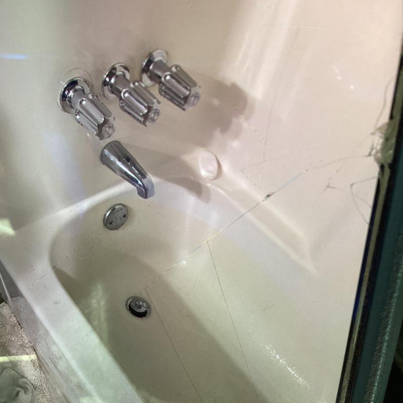 Three-handle tub shower valve trim kit installed