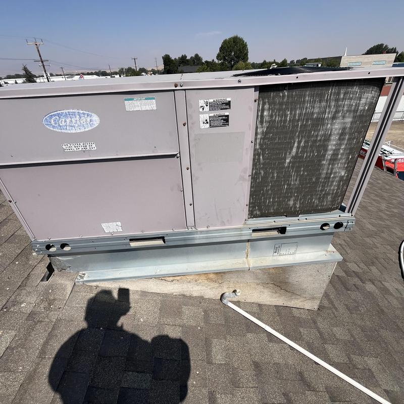 Carrier rooftop unit on commercial building roof Carrier rooftop unit on commercial building roof