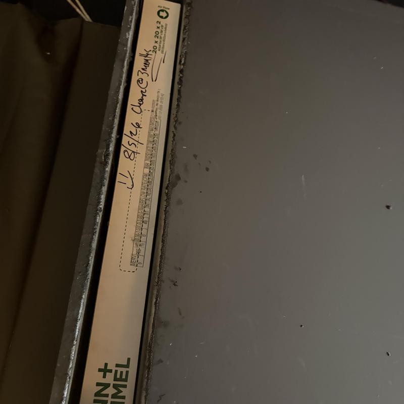 Air filter with handwritten replacement date on box Air filter with handwritten replacement date on box