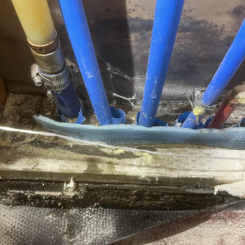 Water service pipe leak through concrete slab opening Water service pipe leak through concrete slab opening