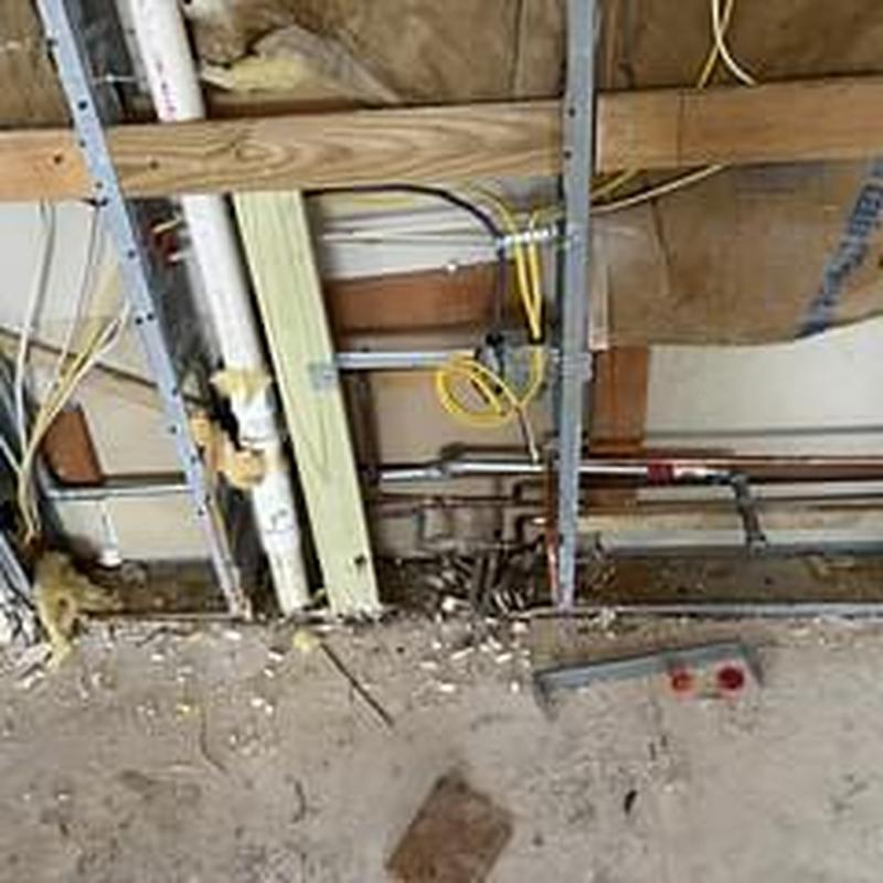 Gas line stub moved under cooktop cabinet with leak test