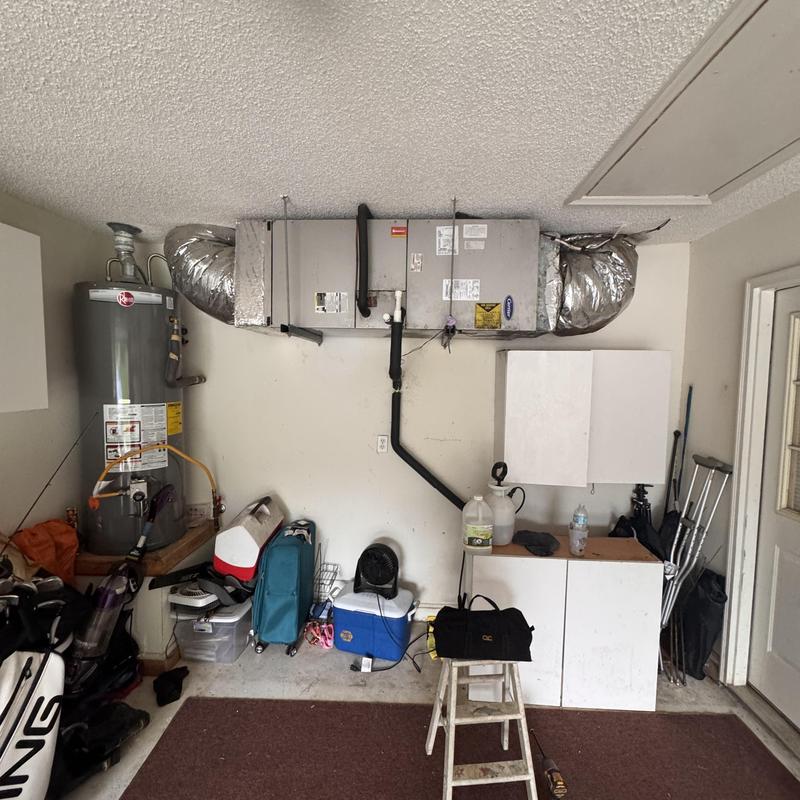 Heat pump split system with ductwork in garage