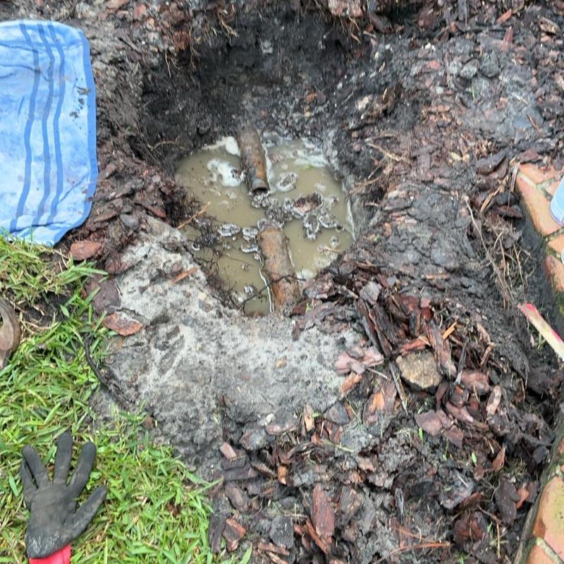 Galvanized pipe section cut and tested in muddy trench Galvanized pipe section cut and tested in muddy trench