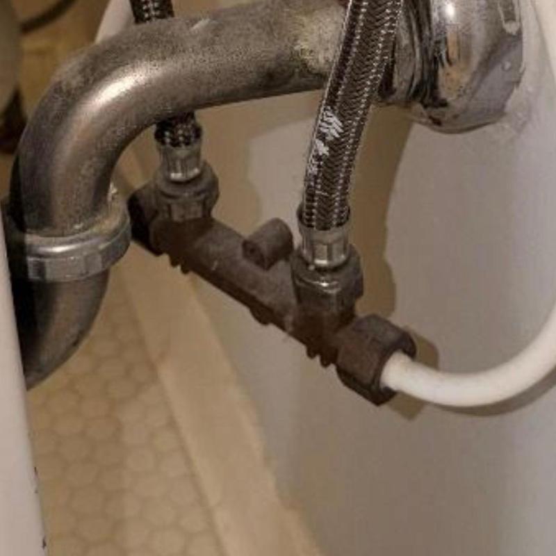 Bathroom sink water supply lines and fittings under sink Bathroom sink water supply lines and fittings under sink
