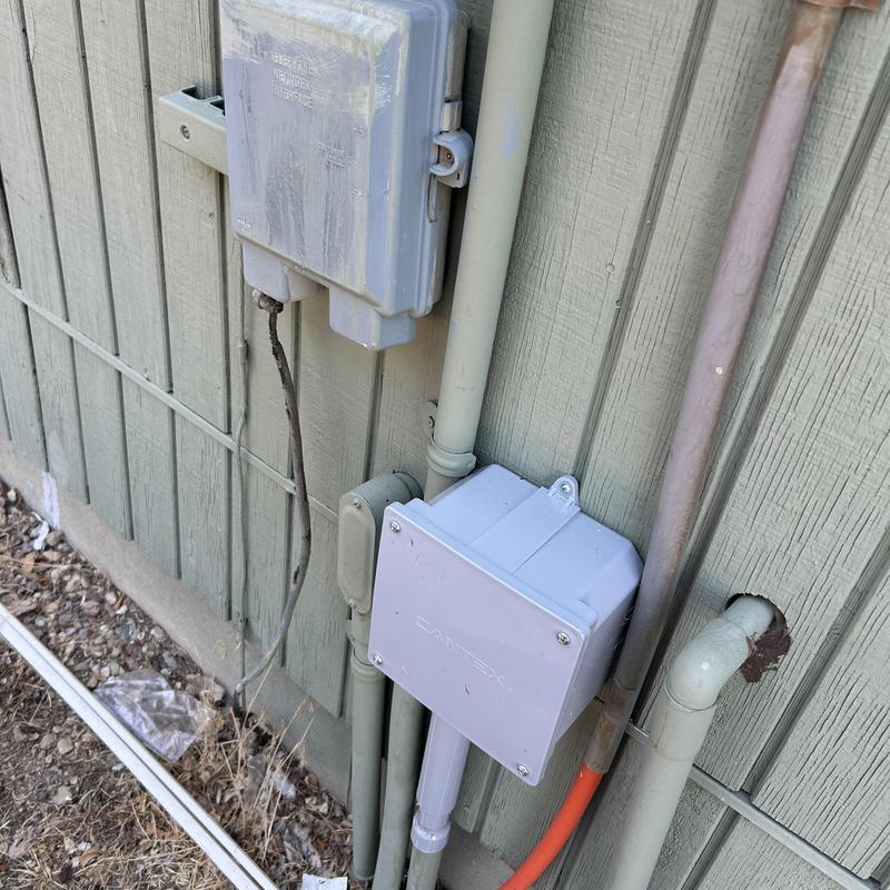 Electrical junction boxes and conduit on exterior wall