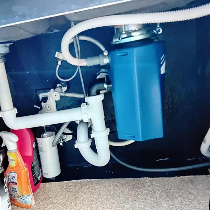 Garbage disposal under sink installation with new unit
