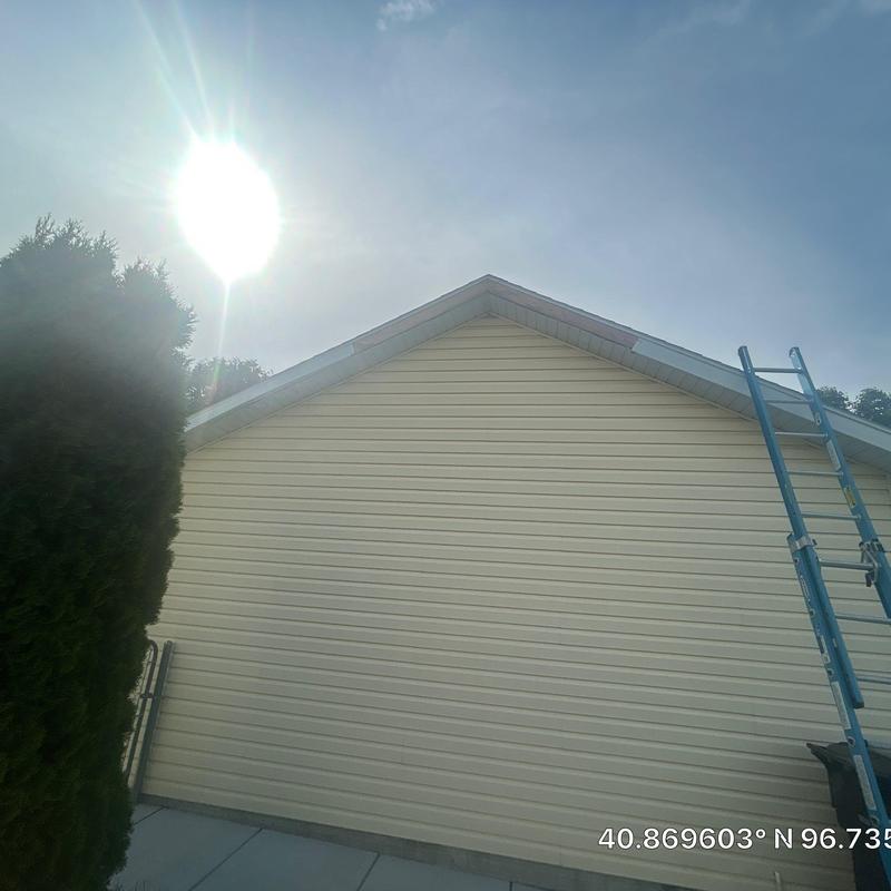 Fascia board on house exterior with ladder nearby Fascia board on house exterior with ladder nearby