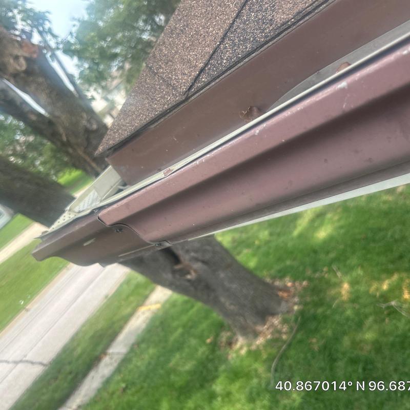 Mastic aluminum gutter coil installed on roof edge Mastic aluminum gutter coil installed on roof edge