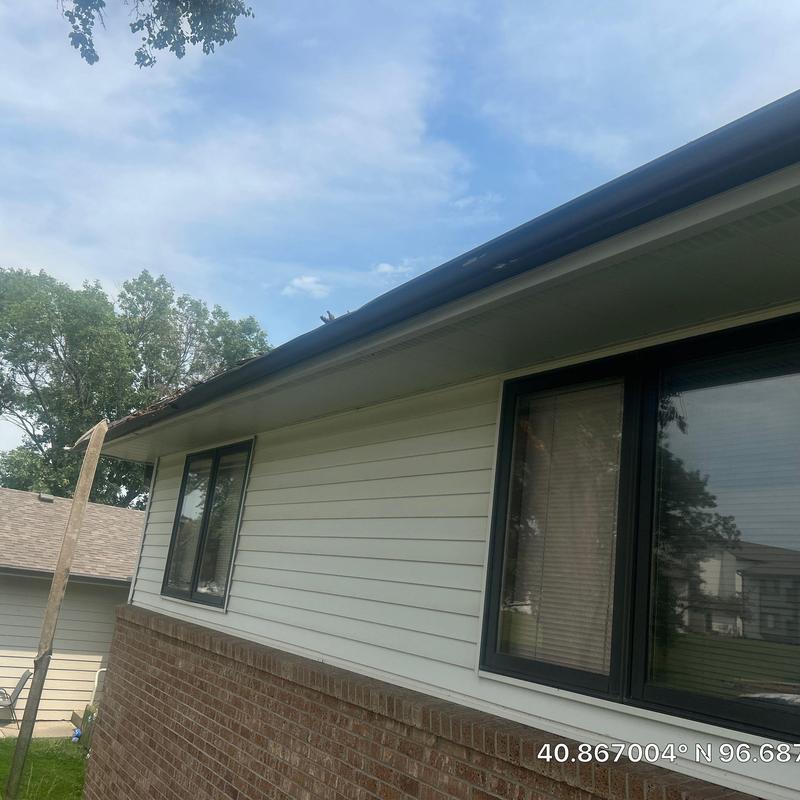Mastic aluminum gutters on residential home exterior Mastic aluminum gutters on residential home exterior
