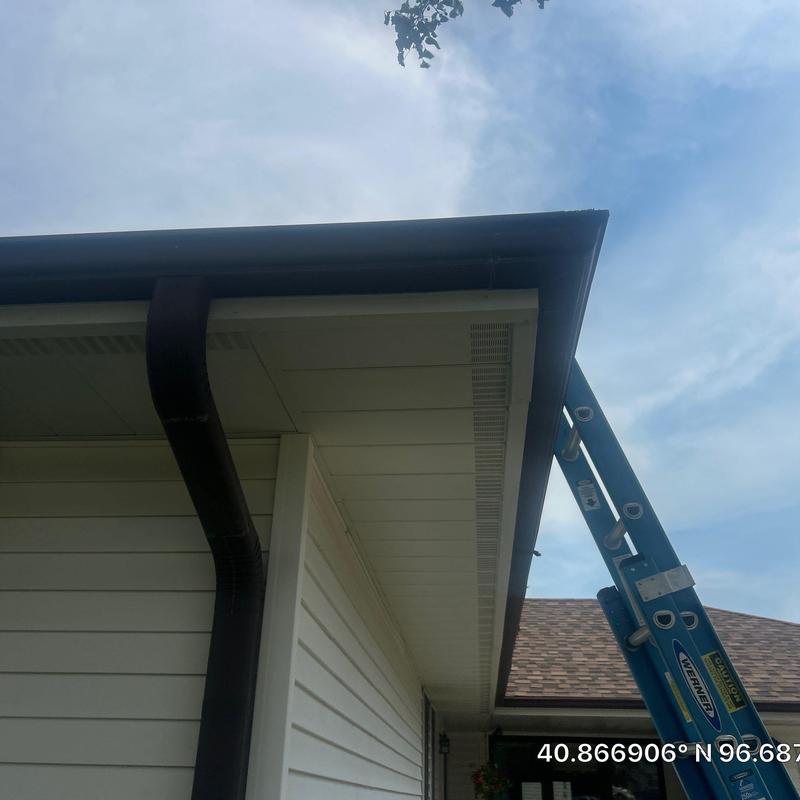 Aluminum gutters and downspout with ladder in Lincoln, NE Aluminum gutters and downspout with ladder in Lincoln, NE