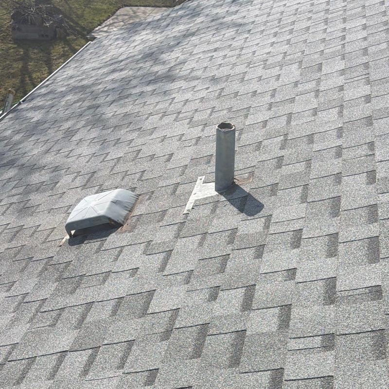 Owens Corning asphalt shingles on residential roof Owens Corning asphalt shingles on residential roof