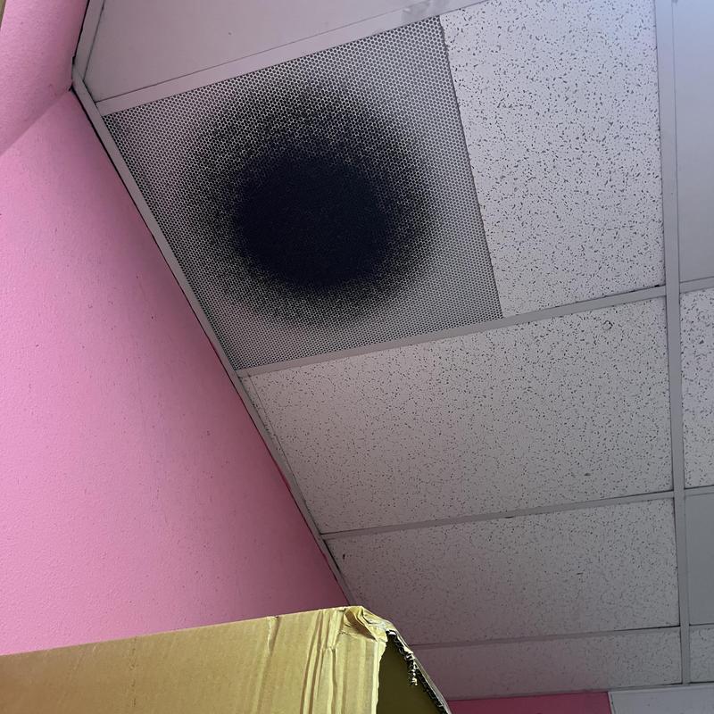 Ceiling vent with large black soot stain Ceiling vent with large black soot stain