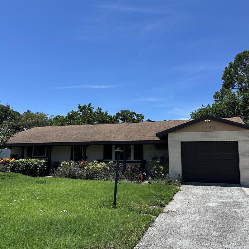 Shingle roof on single-story house with garage