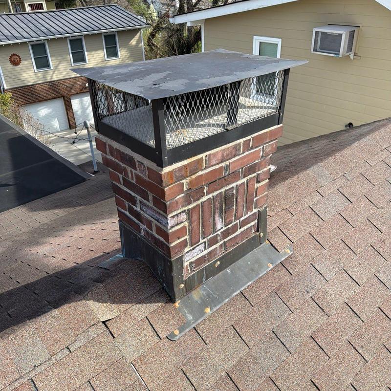 Chimney flashing and cap with roof shingles