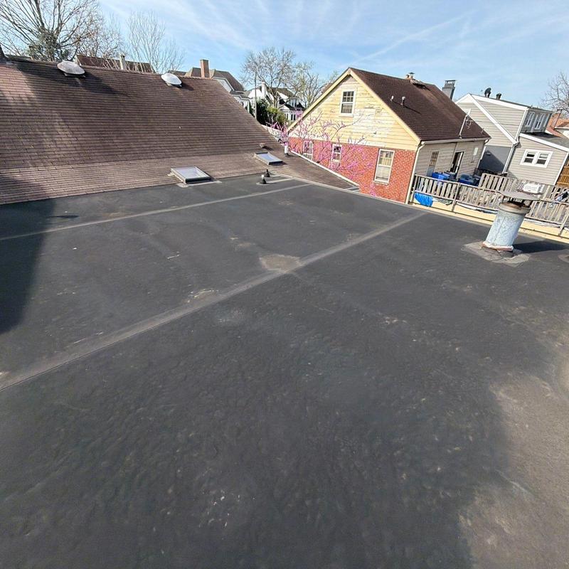 Flat roof rubber membrane with skylights and vent pipe