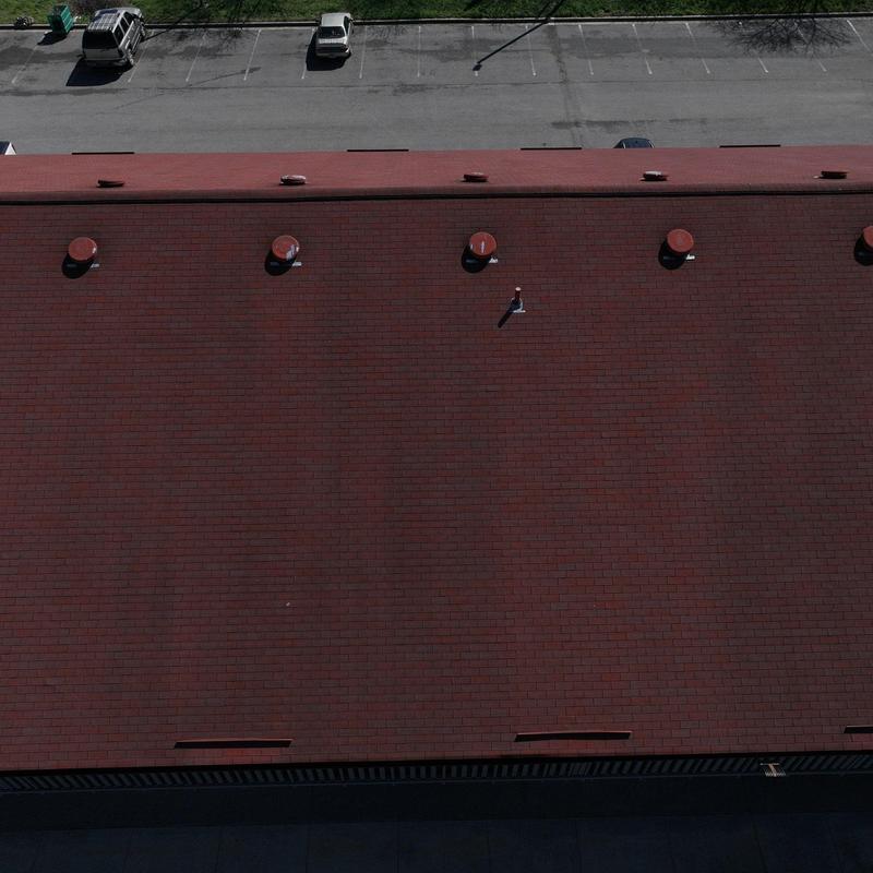 Commercial roof with vent pipes and minor damage