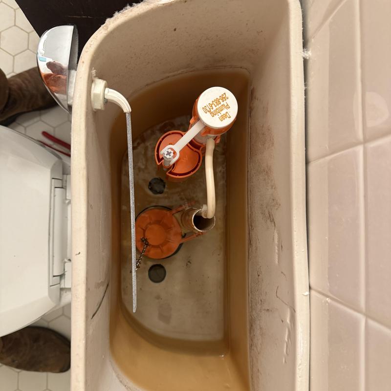 Toilet fill valve and flush valve inside tank