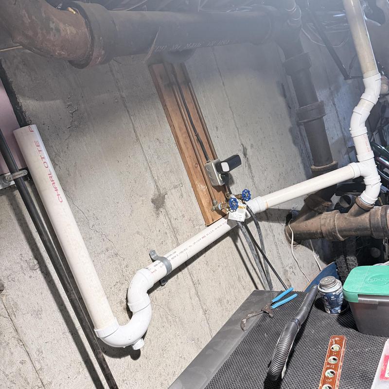PVC drainage and vent piping with shut off valves in basement PVC drainage and vent piping with shut off valves in basement