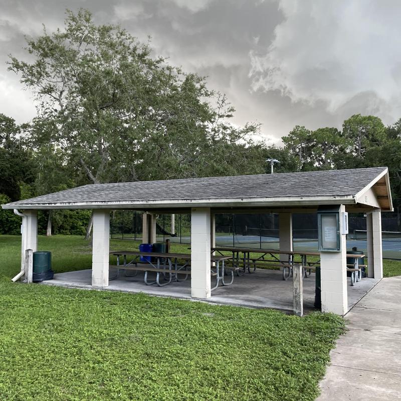 Shingle roof on outdoor pavilion with picnic tables Shingle roof on outdoor pavilion with picnic tables