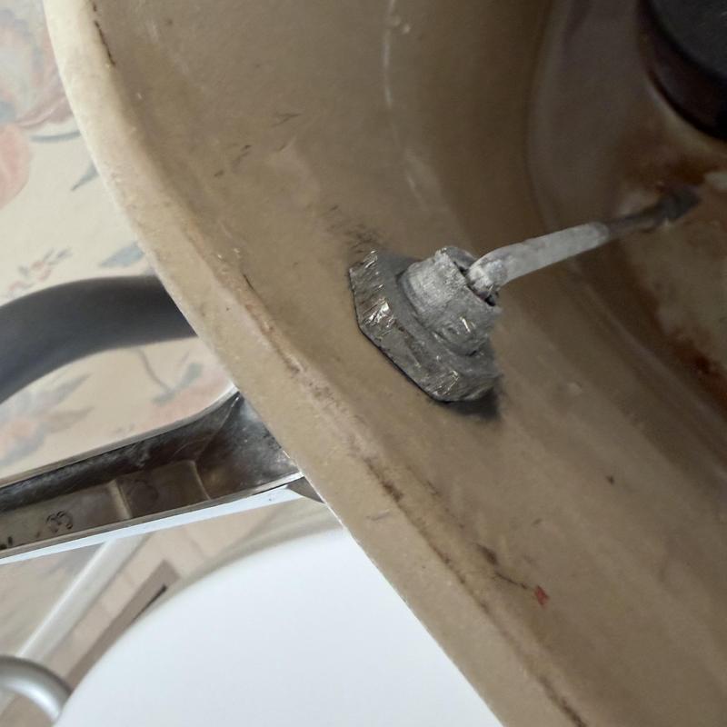 Toilet tank bolt and washer corrosion inside tank Toilet tank bolt and washer corrosion inside tank