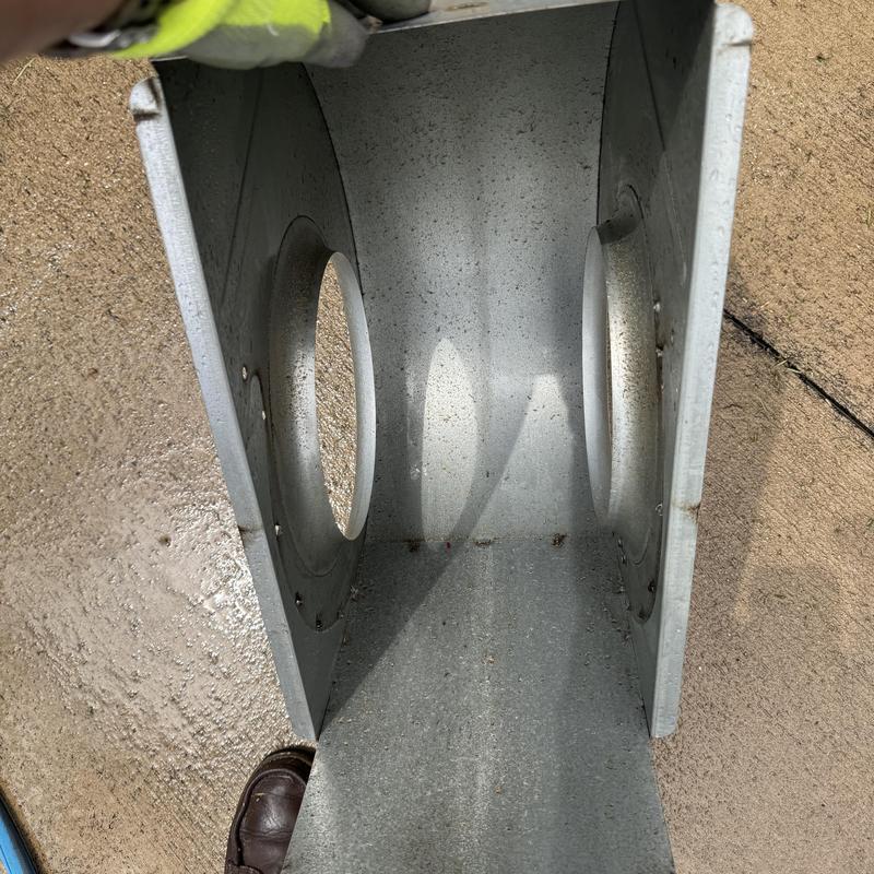 Heat pump duct section with circular vents