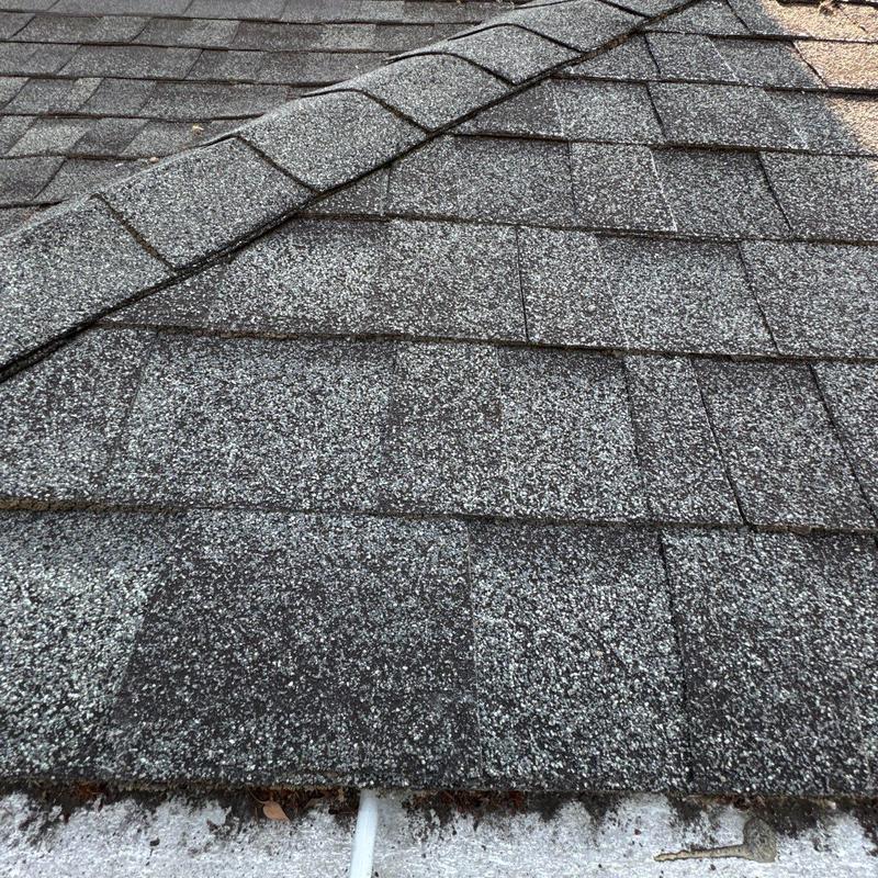 Asphalt shingle roof covering with ridge cap detail