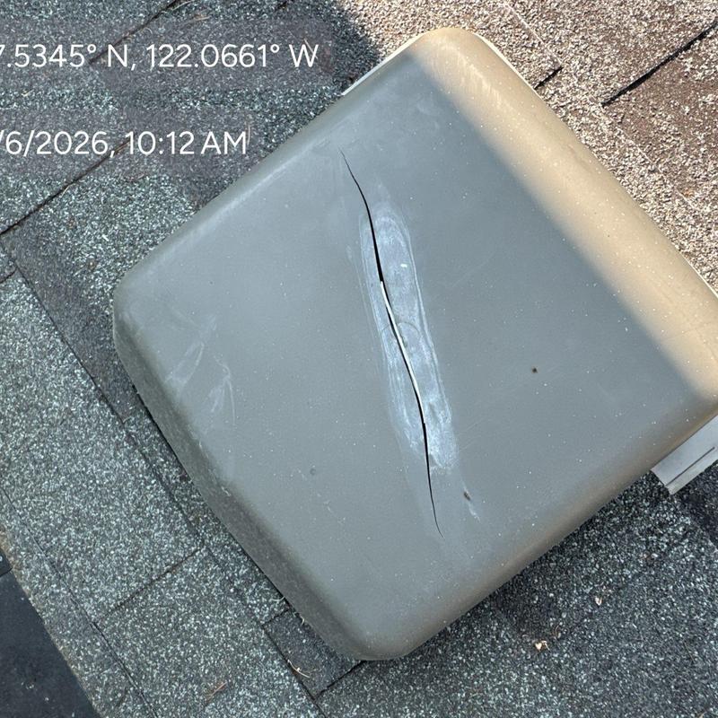 Roof vent with visible crack on shingles roof