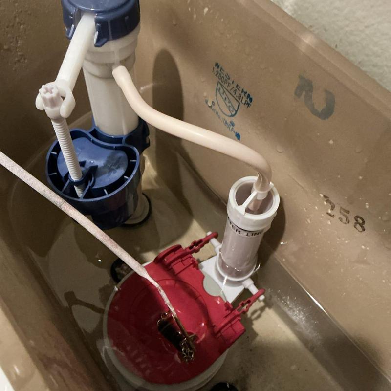 Toilet tank flapper and fill valve inside tank