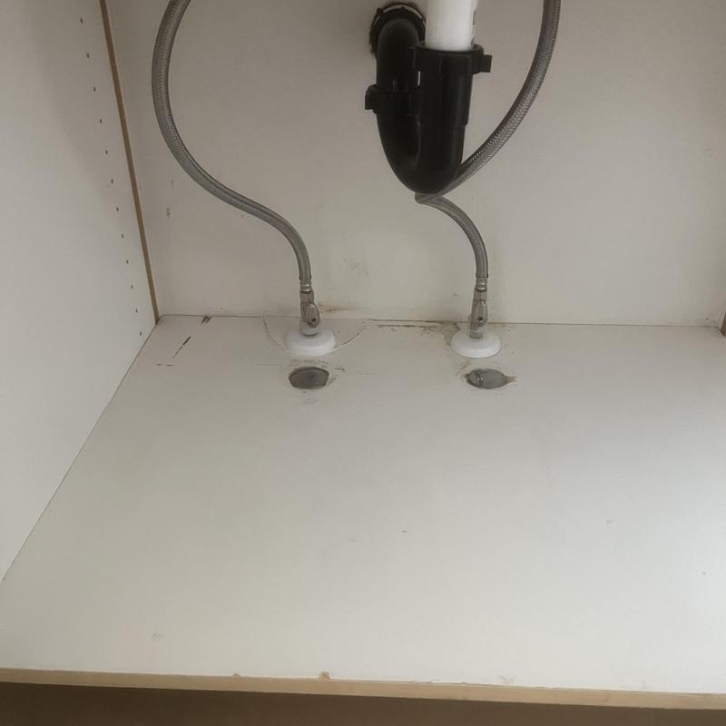 Water supply valves and piping under sink cabinet Water supply valves and piping under sink cabinet