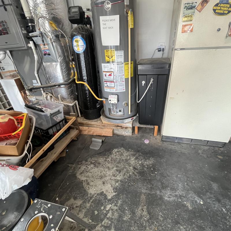 Water heater and filtration system in garage corner Water heater and filtration system in garage corner