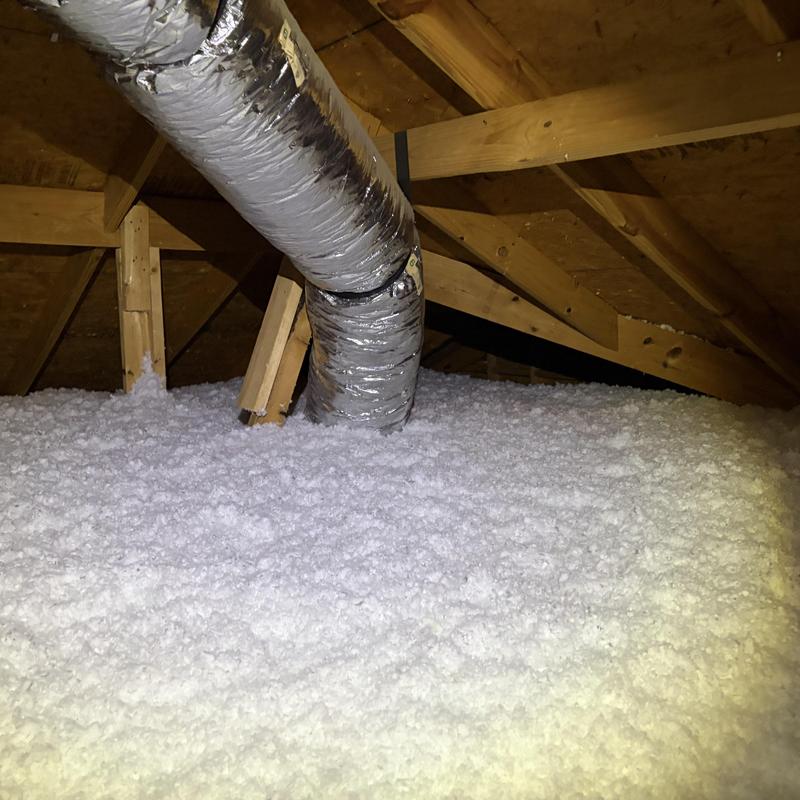 Attic loose-fill insulation with ductwork in attic space