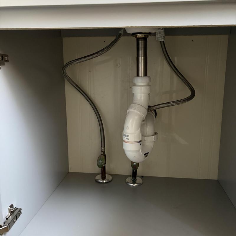 Vanity drain pipe and supply lines under sink Vanity drain pipe and supply lines under sink