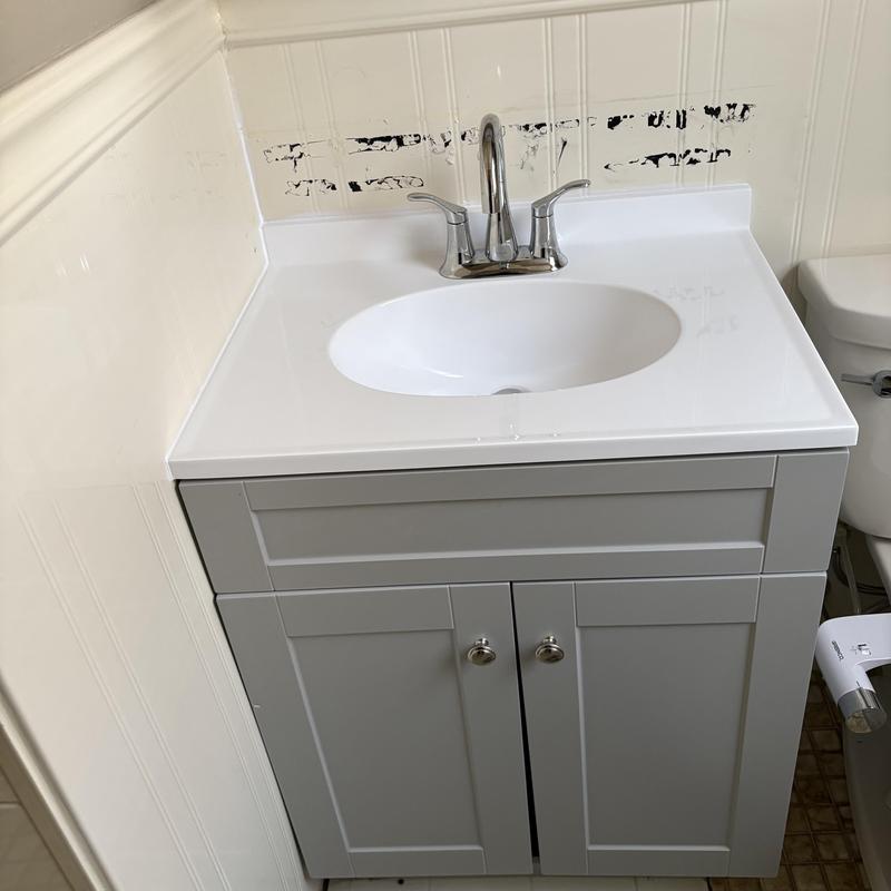 Bathroom vanity with faucet and sealed backsplash Bathroom vanity with faucet and sealed backsplash