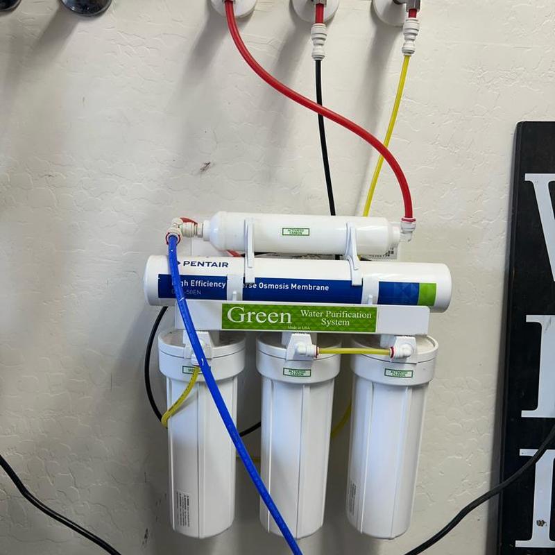 Reverse osmosis water filter with new cartridges installed Reverse osmosis water filter with new cartridges installed
