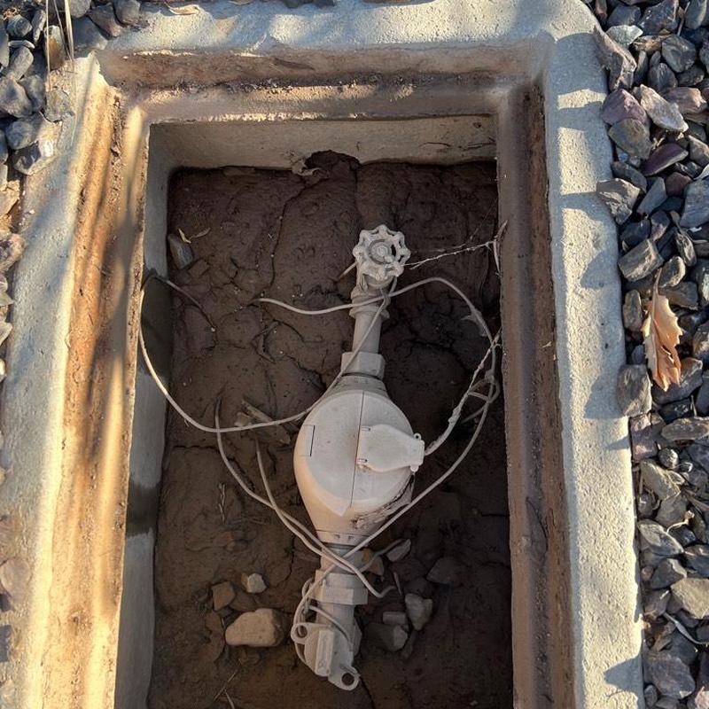Water meter box with connected shutoff valve and wiring Water meter box with connected shutoff valve and wiring