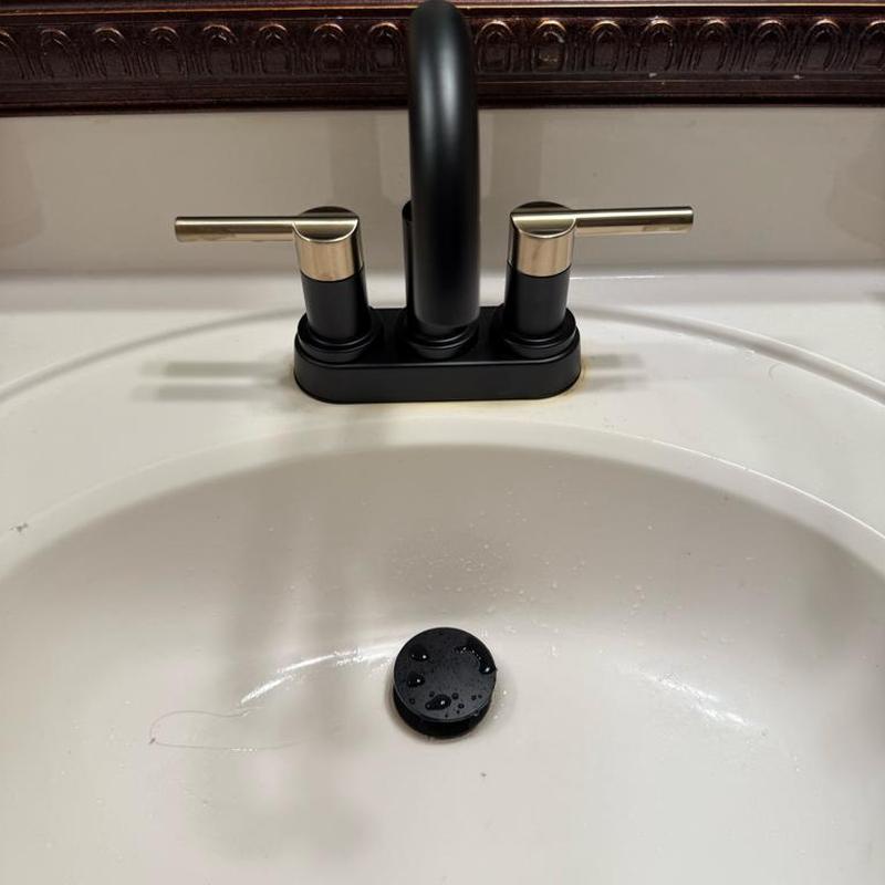 Bathroom sink faucet with dual handles installed